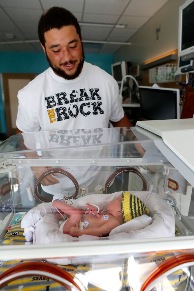 Iowa Hawkeyes offensive lineman Dalton Ferguson (76) and his girlfriend Rachael stand with their newborn twins Ella and Hazel Wednesday, September 12, 2018 in the NICU at the Stead Family Children's Hospital (Brian Ray/hawkeyesports.com)
