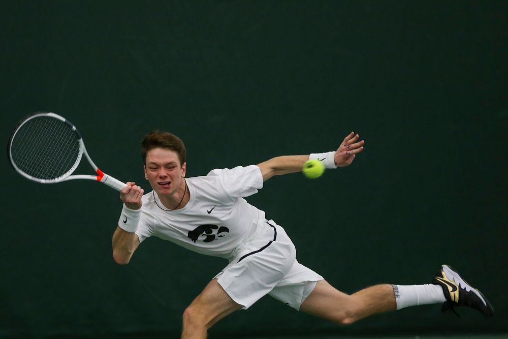 Iowa’s Jason Kerst dives for a ball during the Iowa men’s tennis match vs Western Michigan on Saturday, January 18, 2020 at the Hawkeye Tennis and Recreation Complex. (Lily Smith/hawkeyesports.com)