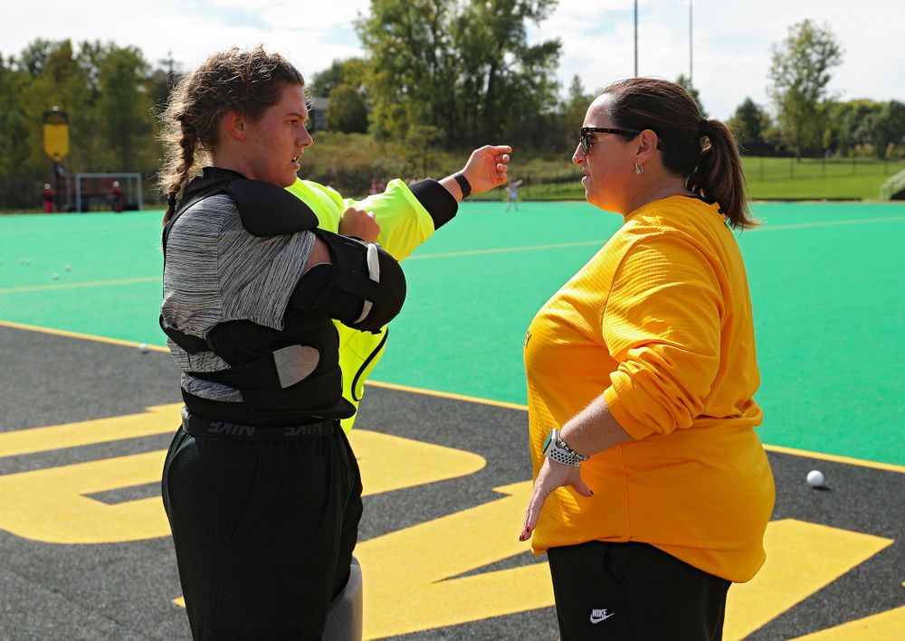 Iowa’s Grace McGuire (62) talks with head coach Lisa Cellucci before the start of their match at Grant Field in Iowa City on Friday, Oct 4, 2019. (Stephen Mally/hawkeyesports.com)