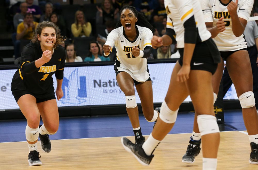 Iowa Hawkeyes defensive specialist Molly Kelly (1) and Iowa Hawkeyes outside hitter Taylor Louis (16) react after winning a point during a game against Purdue at Carver-Hawkeye Arena on October 13, 2018. (Tork Mason/hawkeyesports.com)
