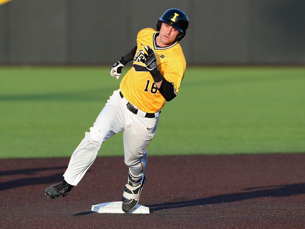 Iowa Hawkeyes shortstop Tanner Wetrich (16) rounds second base after hitting an RBI triple during the seventh inning of their game against Northern Illinois at Duane Banks Field in Iowa City on Tuesday, Apr. 16, 2019. (Stephen Mally/hawkeyesports.com)