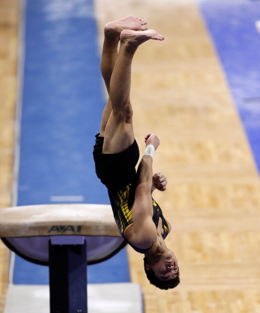Addison Chung competes on the vault against Illinois 