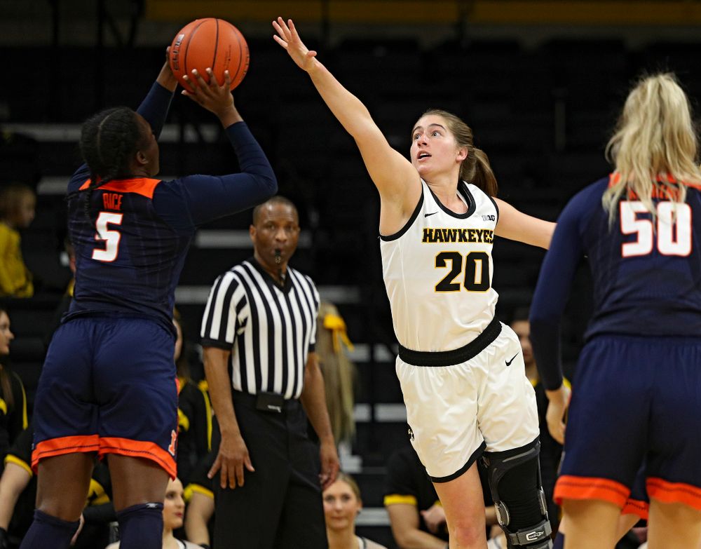 Iowa Hawkeyes guard Kate Martin (20) reaches for a shot during the third quarter of their game at Carver-Hawkeye Arena in Iowa City on Tuesday, December 31, 2019. (Stephen Mally/hawkeyesports.com)