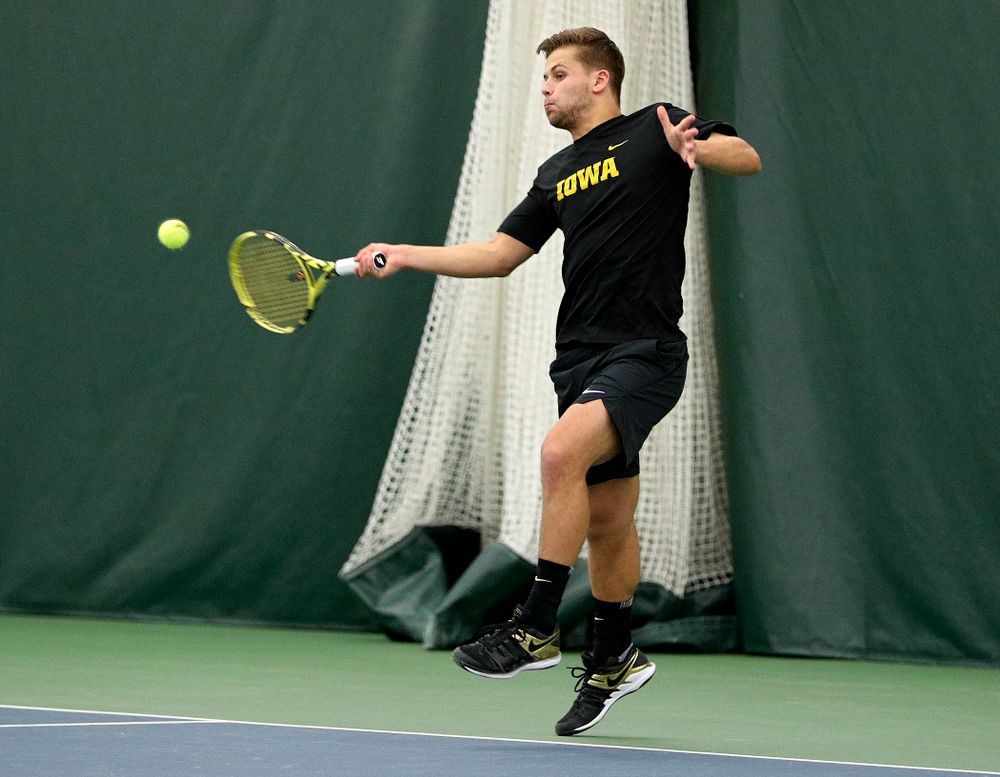 Iowa’s Will Davies returns a shot during his doubles match at the Hawkeye Tennis and Recreation Complex in Iowa City on Friday, February 14, 2020. (Stephen Mally/hawkeyesports.com)