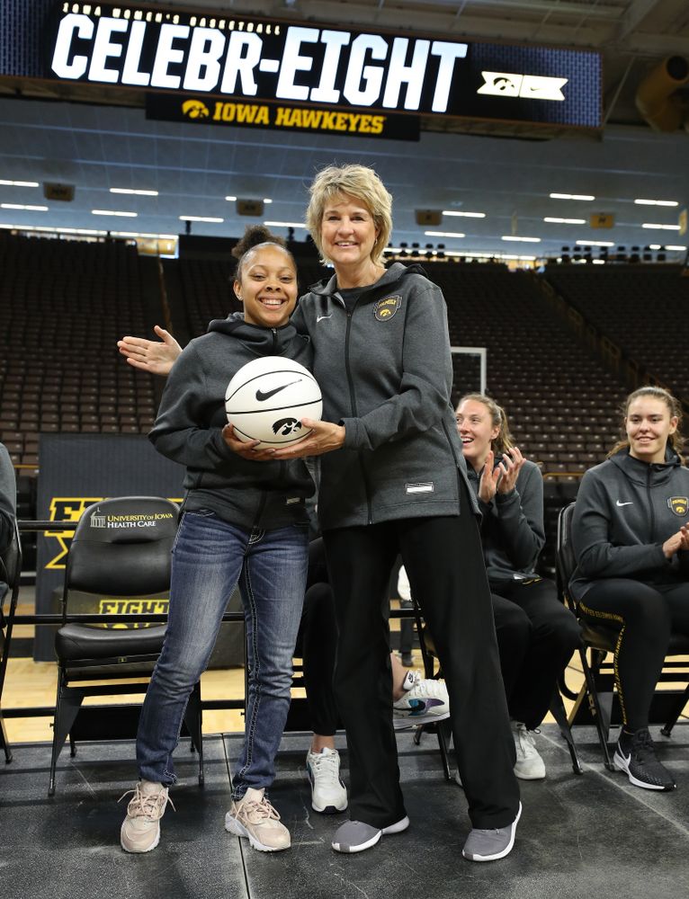 Iowa Hawkeyes head coach Lisa Bluder presents guard Tania Davis (11) with a ball commemorating her 1,00th point during the teamÕs Celebr-Eight event Wednesday, April 24, 2019 at Carver-Hawkeye Arena. (Brian Ray/hawkeyesports.com)