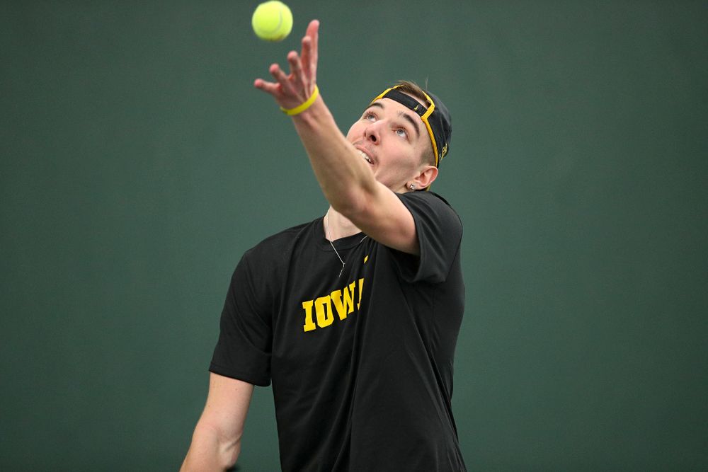 Iowa’s Nikita Snezhko serves during his singles match at the Hawkeye Tennis and Recreation Complex in Iowa City on Friday, February 14, 2020. (Stephen Mally/hawkeyesports.com)