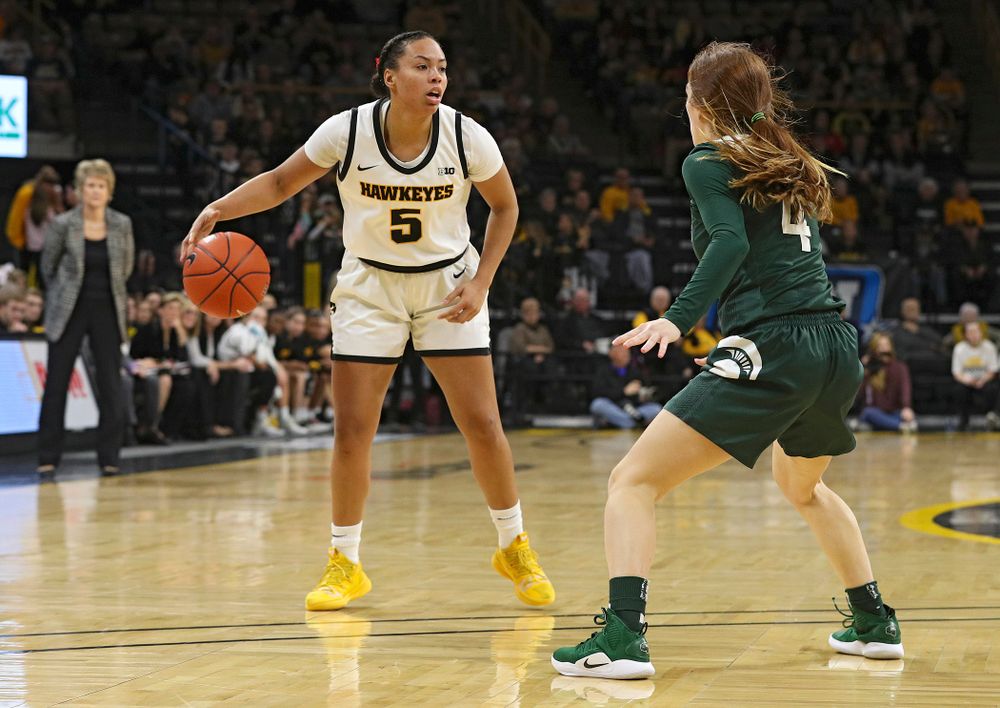 Iowa Hawkeyes guard Alexis Sevillian (5) dribbles the ball during the second quarter of their game at Carver-Hawkeye Arena in Iowa City on Sunday, January 26, 2020. (Stephen Mally/hawkeyesports.com)