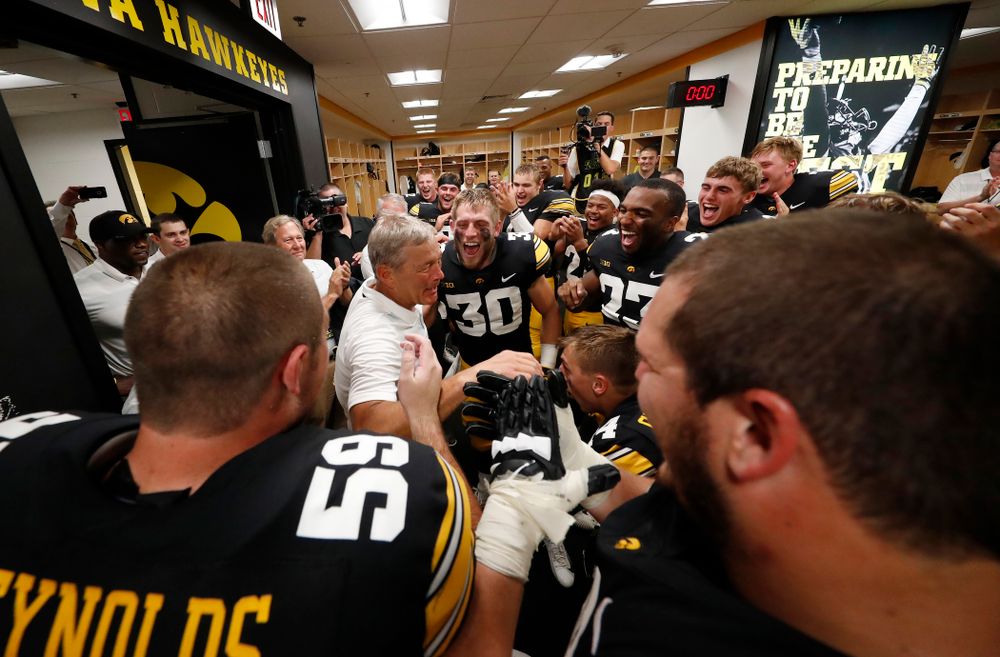 Iowa Hawkeyes head coach Kirk Ferentz  celebrates his historic victory with his team following their game against the Northern Illinois Huskies Saturday, September 1, 2018 at Kinnick Stadium. (Brian Ray/hawkeyesports.com)