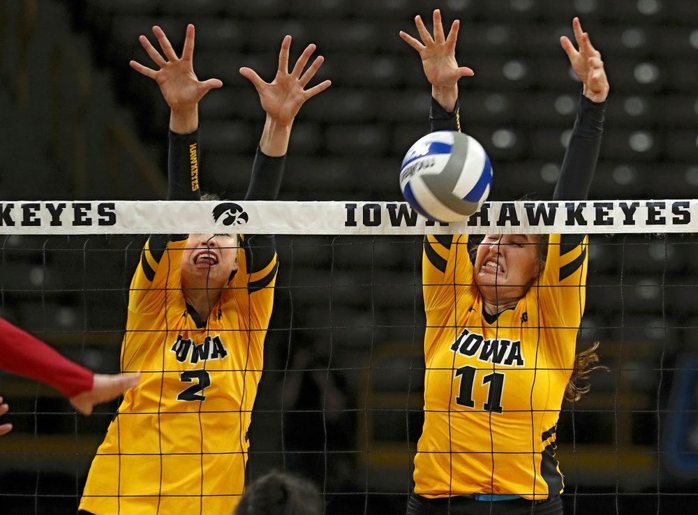Iowa’s Blythe Rients (11) gets a block as Courtney Buzzerio (2) looks on during their match at Carver-Hawkeye Arena in Iowa City on Sunday, Oct 20, 2019. (Stephen Mally/hawkeyesports.com)