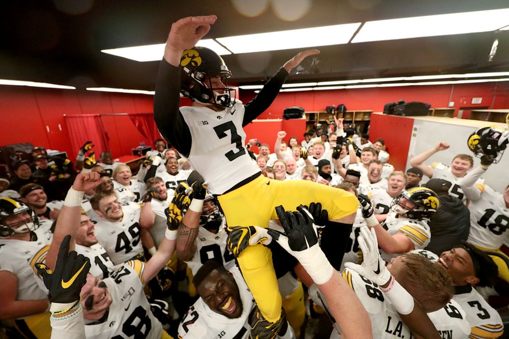 The Iowa Hawkeyes hoist up place kicker Keith Duncan (3) as they celebrate their victory against the Nebraska Cornhuskers Friday, November 29, 2019 at Memorial Stadium in Lincoln, Neb. (Brian Ray/hawkeyesports.com)