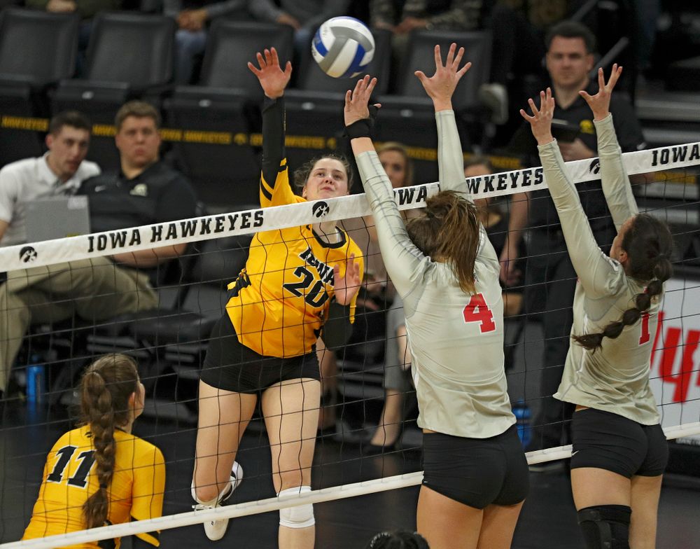 Iowa’s Edina Schmidt (20) lines up a kill during the second set of their match at Carver-Hawkeye Arena in Iowa City on Friday, Nov 29, 2019. (Stephen Mally/hawkeyesports.com)