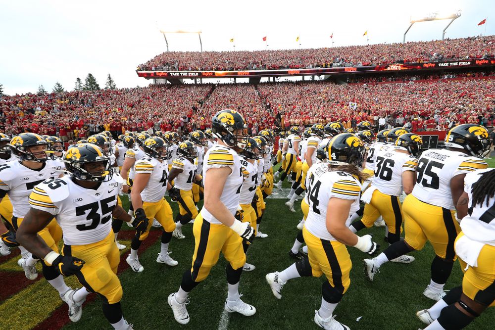 The Iowa Hawkeyes swarm onto the field for their game against the Iowa State Cyclones Saturday, September 14, 2019 at Jack Trice Stadium in Ames, Iowa. (Brian Ray/hawkeyesports.com)