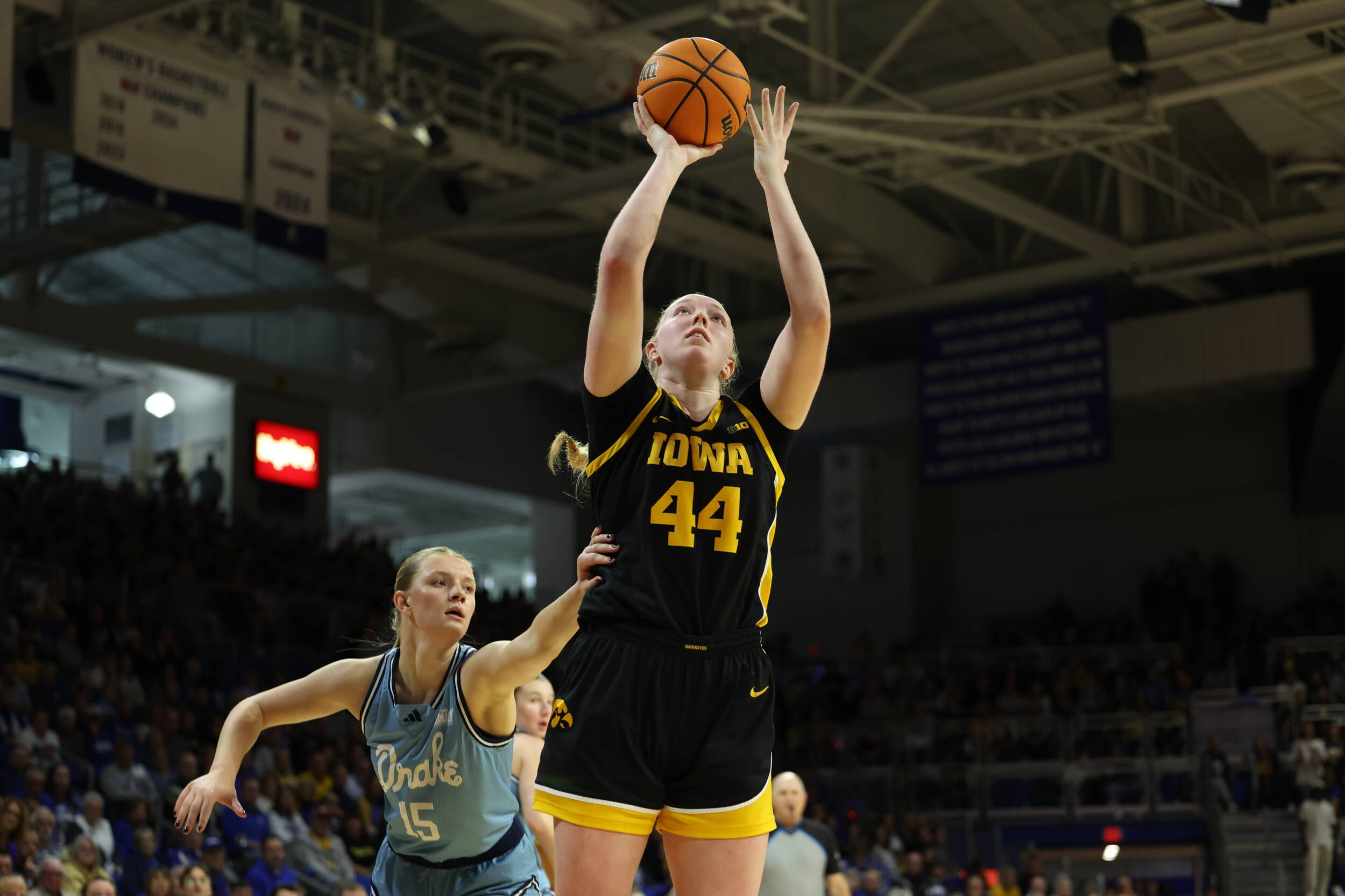 No. 22 Iowa Outlasts Rhode Island