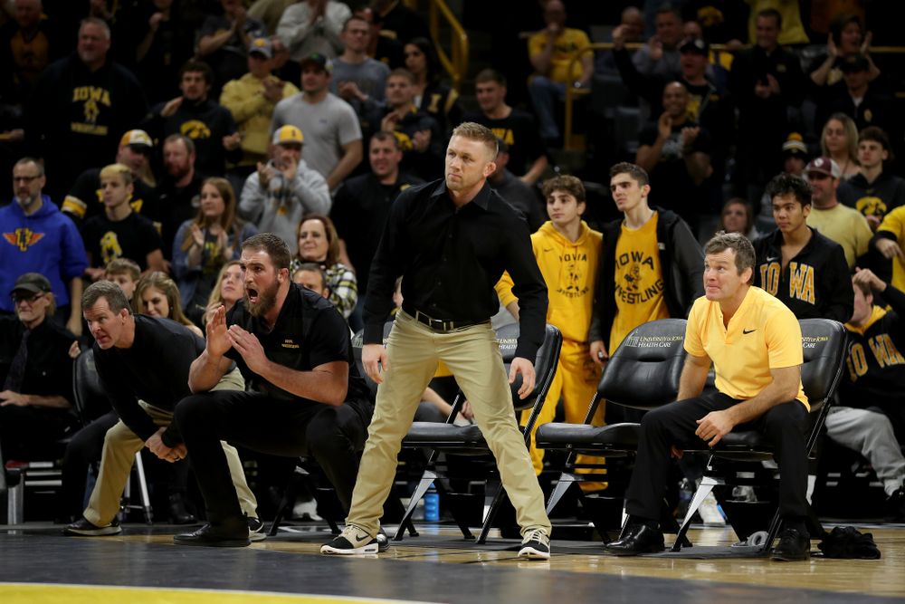 The Iowa Hawkeyes coaches as Alex Marinelli wrestles WisconsinÕs Evan Wick at 165 pounds Sunday, December 1, 2019 at Carver-Hawkeye Arena. Marinelli won the match 4-2. (Brian Ray/hawkeyesports.com)