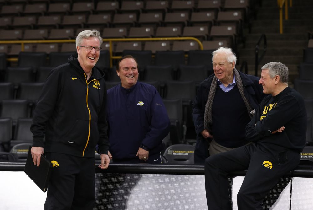 Iowa Hawkeyes head coach Fran McCaffery and assistant coach Kirk Speraw talk with television announcers Tim Brando and Bill Rafferty before their game against the Michigan State Spartans Thursday, January 24, 2019 at Carver-Hawkeye Arena. (Brian Ray/hawkeyesports.com)