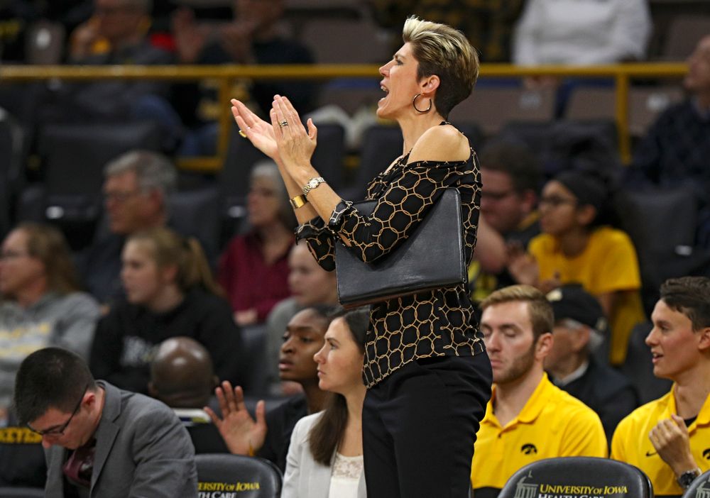 Iowa associate head coach Jan Jensen claps during the third quarter of their overtime win against Princeton at Carver-Hawkeye Arena in Iowa City on Wednesday, Nov 20, 2019. (Stephen Mally/hawkeyesports.com)