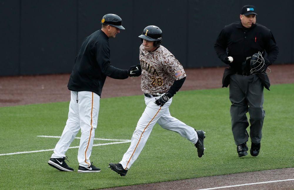 Iowa Hawkeyes infielder Chris Whelan (28) and head coach Rick Heller during a double header against the Indiana Hoosiers Friday, March 23, 2018 at Duane Banks Field. (Brian Ray/hawkeyesports.com)