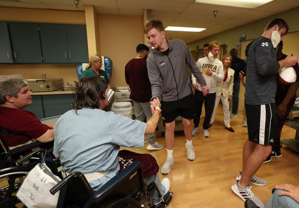 Iowa Hawkeyes quarterback Spencer Petras (7) shakes hands with a patient during a visit to Tampa General Hospital as part of the Outback Bowl Friday, December 28, 2018 in Tampa, FL.(Brian Ray/hawkeyesports.com)