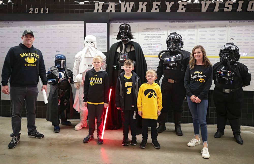 Iowa Hawkeyes fan pose with Star Wars characters on the concourse before the game at Carver-Hawkeye Arena in Iowa City on Sunday, December 29, 2019. (Stephen Mally/hawkeyesports.com)