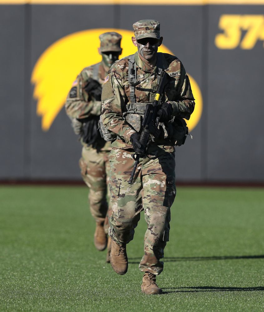 Members of the University of Iowa ROTC deliver the game ball before the Iowa Hawkeyes game against the Nebraska Cornhuskers on Military Appreciation Night Friday, April 19, 2019 at Duane Banks Field. (Brian Ray/hawkeyesports.com)