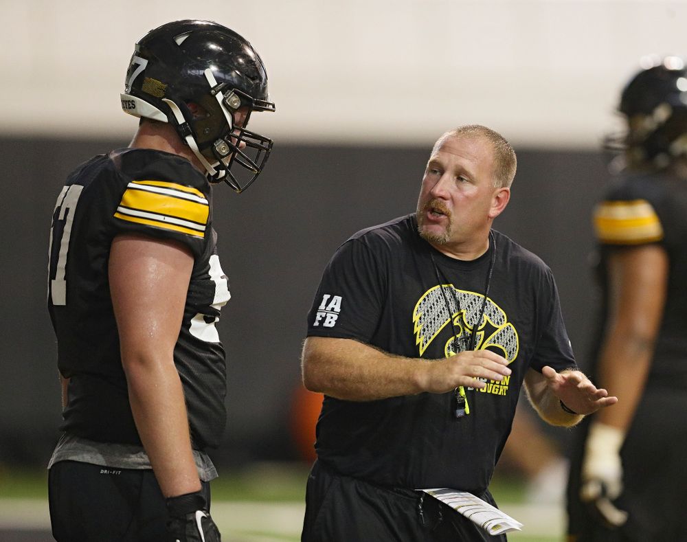 Iowa Hawkeyes offensive lineman Clayton Thurm (57) listens to offensive line coach Tim Polasek during Fall Camp Practice No. 9 at the Hansen Football Performance Center in Iowa City on Monday, Aug 12, 2019. (Stephen Mally/hawkeyesports.com)