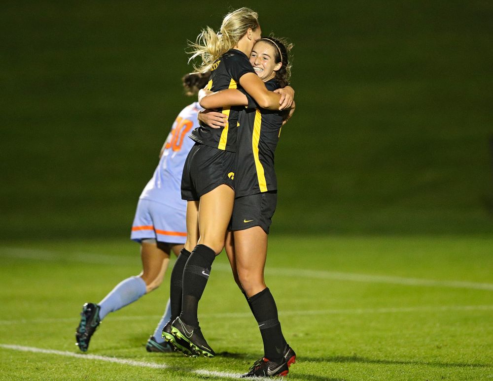 Iowa midfielder Hailey Rydberg (2) jumps into the arms of forward Kaleigh Haus (4) after Haus scored a goal during the second half of their match against Illinois at the Iowa Soccer Complex in Iowa City on Thursday, Sep 26, 2019. (Stephen Mally/hawkeyesports.com)