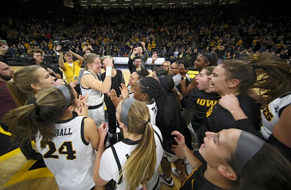The Hawkeyes huddle after their double overtime win at Carver-Hawkeye Arena in Iowa City on Sunday, January 12, 2020. (Stephen Mally/hawkeyesports.com)