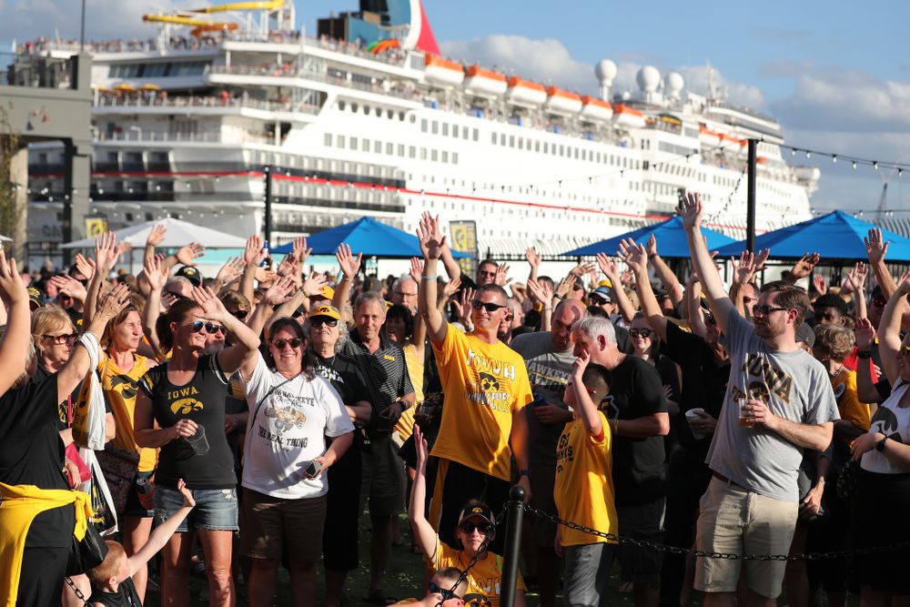 Fans wave to the folks back in Iowa during their Hawkeye Huddle Monday, December 31, 2018 at Sparkman Wharf in Tampa, FL. (Brian Ray/hawkeyesports.com)