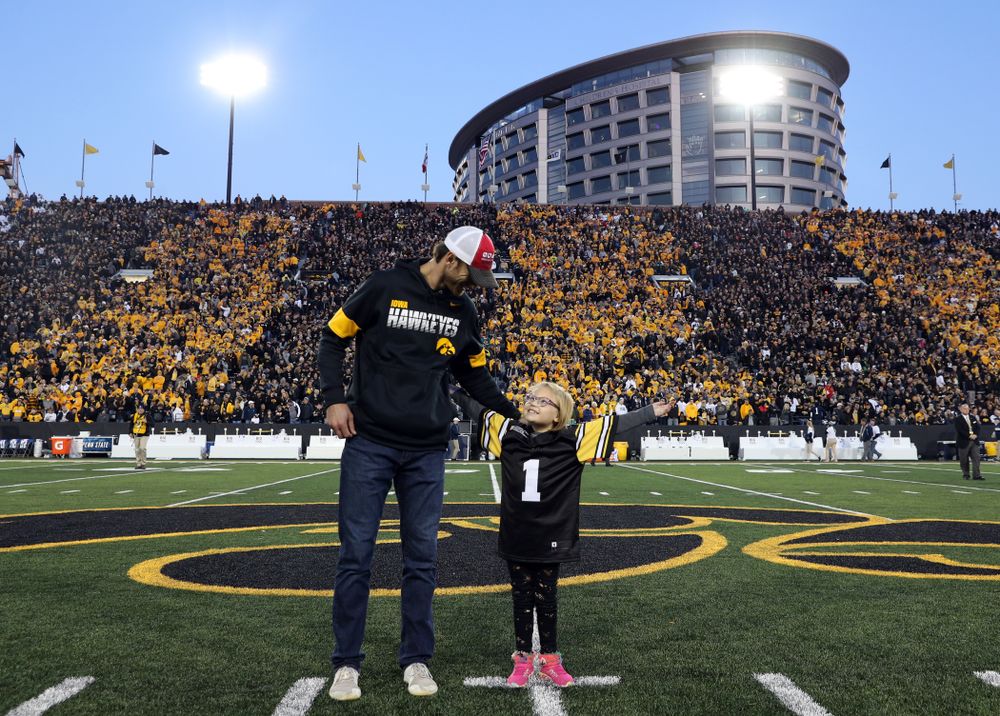 Honorary Captain Ricky Stanzi and Stead Family ChildrenÕs Hospital Kid Captain Gabby Yoder before the Iowa Hawkeyes game against the Penn State Nittany Lions Saturday, October 12, 2019 at Kinnick Stadium. (Brian Ray/hawkeyesports.com)