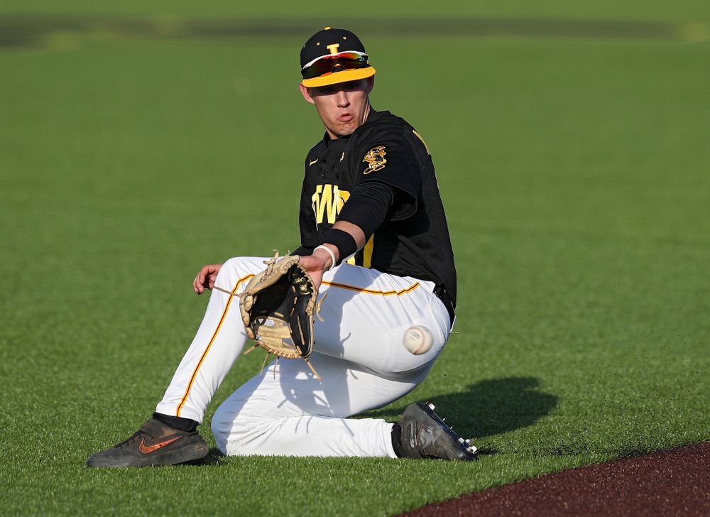 Iowa shortstop Dylan Nedved (17) fields a ground ball during the fifth inning of their college baseball game at Duane Banks Field in Iowa City on Tuesday, March 10, 2020. (Stephen Mally/hawkeyesports.com)