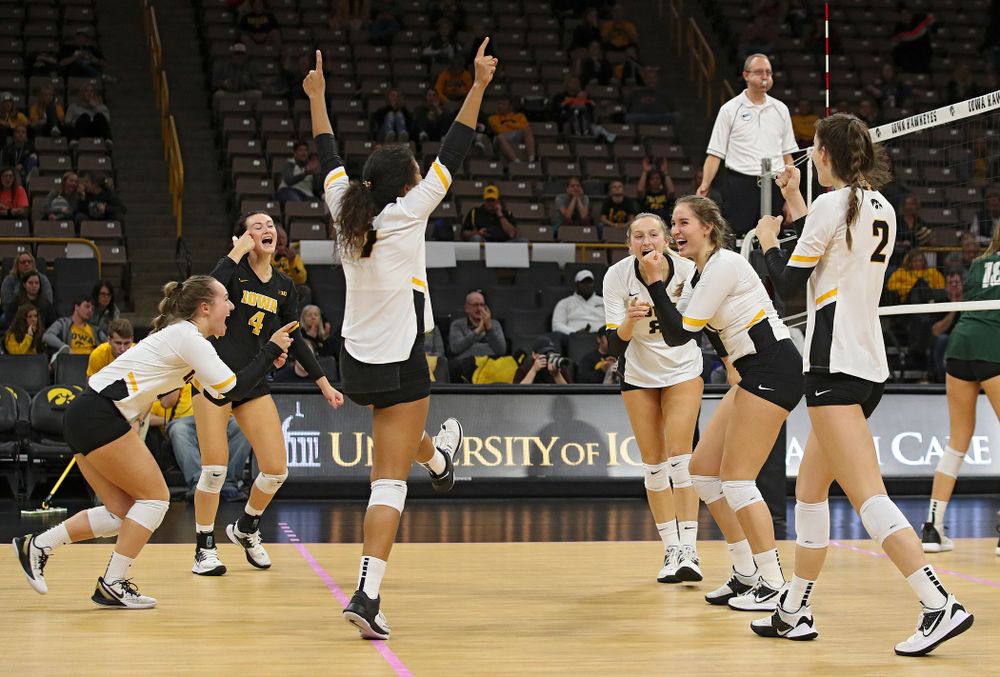 Iowa’s Joslyn Boyer (1), Halle Johnston (4), Brie Orr (7), Kyndra Hansen (8), Blythe Rients (11), and Courtney Buzzerio (2) celebrate a score during the third set of their volleyball match at Carver-Hawkeye Arena in Iowa City on Sunday, Oct 13, 2019. (Stephen Mally/hawkeyesports.com)