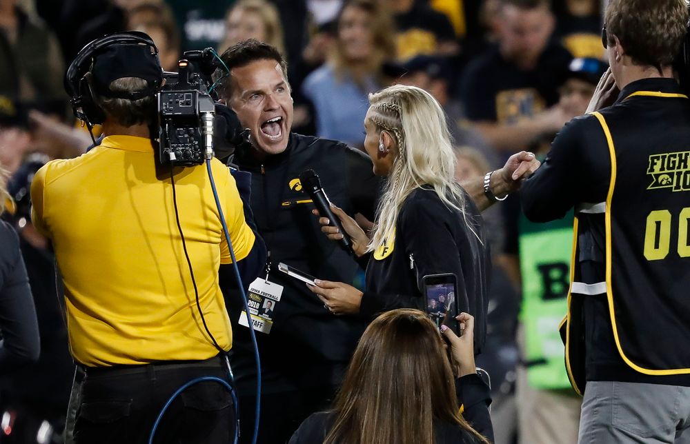Iowa Hawkeyes volleyball head coach Bond Shymansky addresses the crowd in a timeout during a game against Wisconsin at Kinnick Stadium on September 22, 2018. (Tork Mason/hawkeyesports.com)