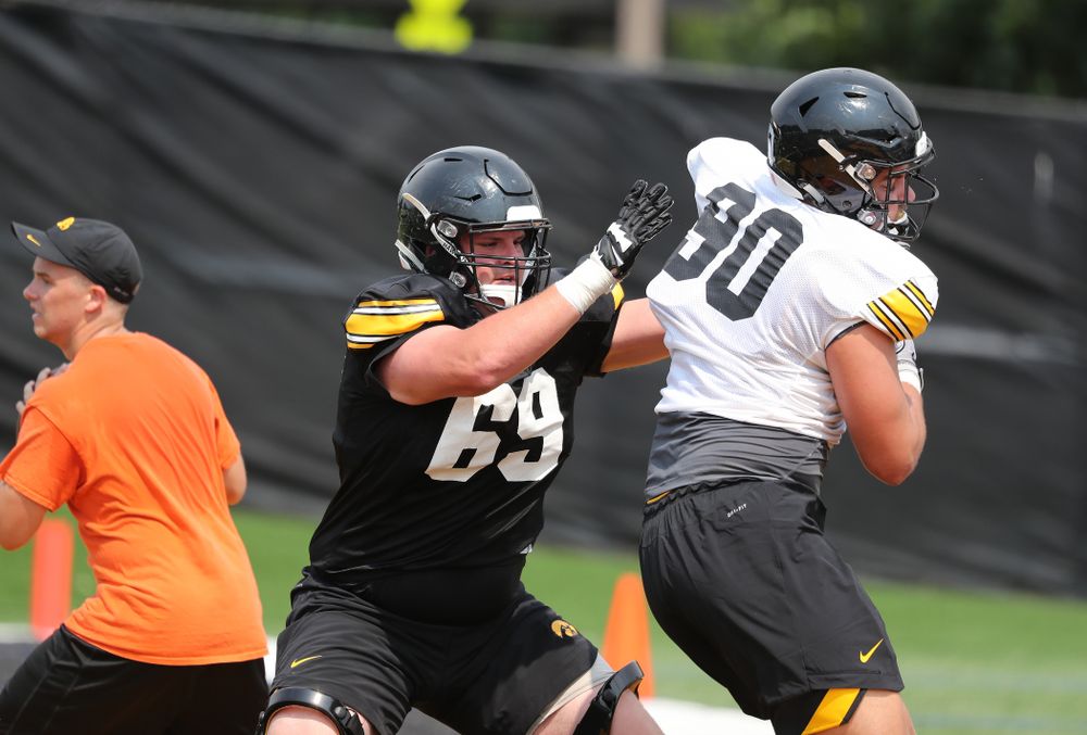 Iowa Hawkeyes offensive lineman Keegan Render (69) against defensive end Sam Brincks (90) during the third practice of fall camp Sunday, August 5, 2018 at the Kenyon Football Practice Facility. (Brian Ray/hawkeyesports.com)