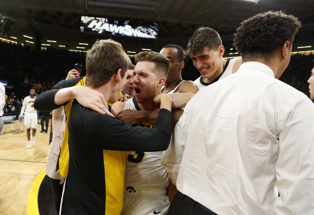 Iowa Hawkeyes guard Jordan Bohannon (3) celebrates with his teammates after making the game winning three point basket against the Northwestern Wildcats Sunday, February 10, 2019 at Carver-Hawkeye Arena. (Brian Ray/hawkeyesports.com)