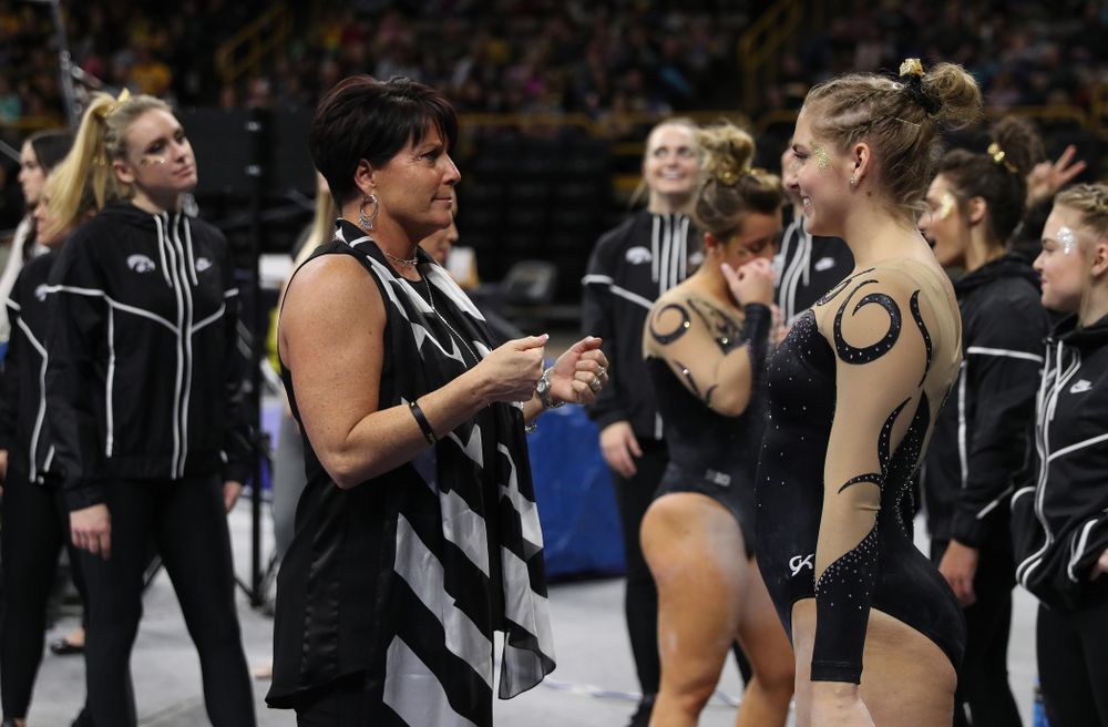 Iowa assistant coach Jennifer Green talks with Emma Hartzler before her routine on the beam during their meet against Southeast Missouri State Friday, January 11, 2019 at Carver-Hawkeye Arena. (Brian Ray/hawkeyesports.com)