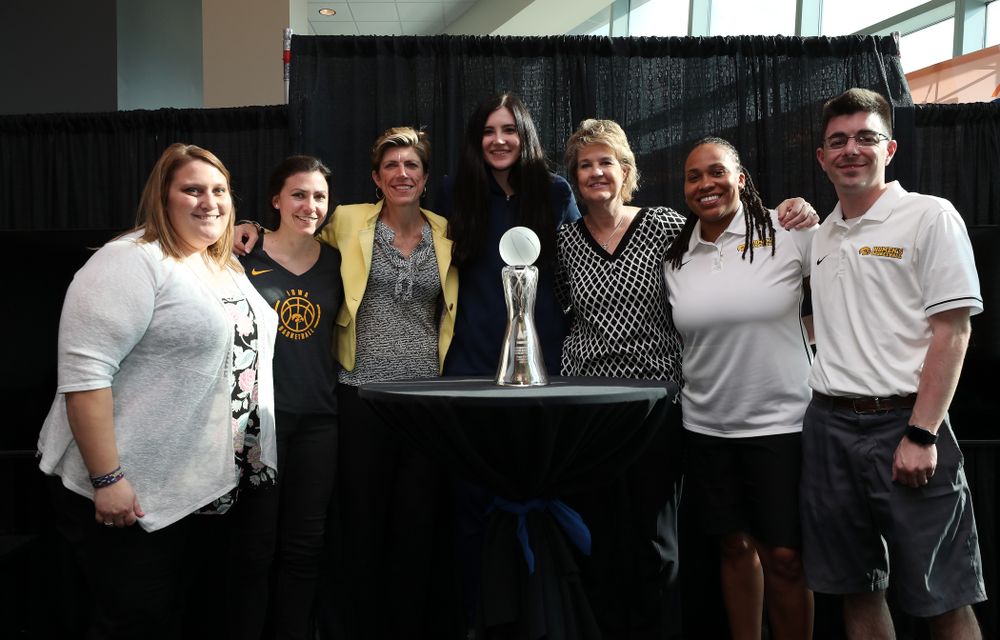 Iowa Hawkeyes forward Megan Gustafson (10) poses for  photo with the Iowa Women's Basketball staff after winning the Associated Press Player Of The Year during a news conference Thursday, April 4, 2019 at Amalie Arena in Tampa, FL. (Brian Ray/hawkeyesports.com)