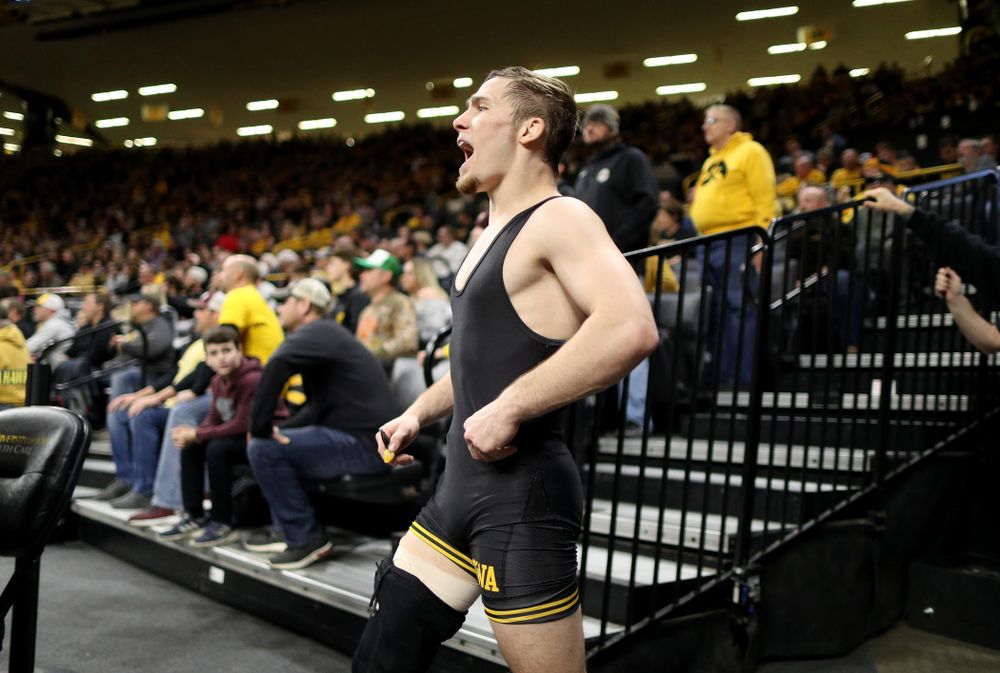 IowaÕs Spencer Lee cheers on teammate Austin DeSanto as he wrestles WisconsinÕs  Seth Gross at 133 pounds Sunday, December 1, 2019 at Carver-Hawkeye Arena. DeSanto won the match 6-2. (Brian Ray/hawkeyesports.com)