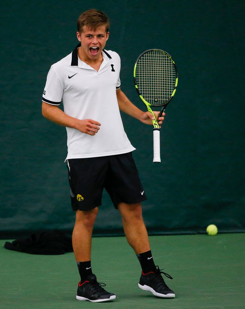Iowa's Will Davies reacts after winning a point