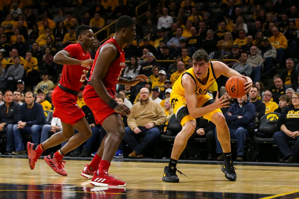 Iowa Hawkeyes center Luka Garza (55) looks to pass the ball during the Iowa men’s basketball game vs Rutgers on Wednesday, January 22, 2020 at Carver-Hawkeye Arena. (Lily Smith/hawkeyesports.com)