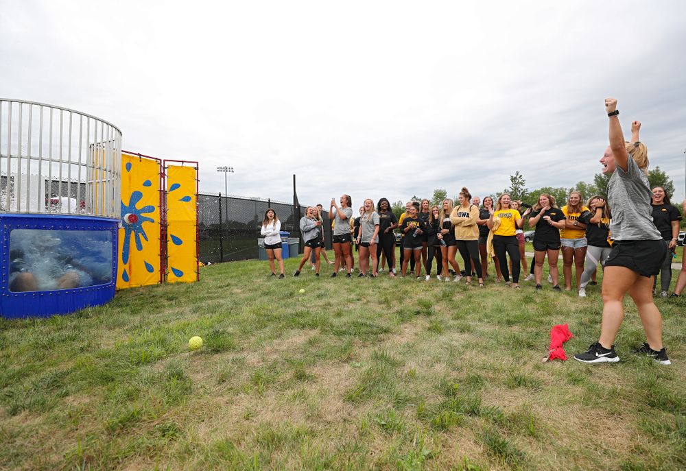 Iowa Field Hockey’s Ryley Miller sinks assistant strength and conditioning coach Ashley Renteria in the dunk tank during the Student-Athlete Kickoff outside the Karro Athletics Hall of Fame Building in Iowa City on Sunday, Aug 25, 2019. (Stephen Mally/hawkeyesports.com)
