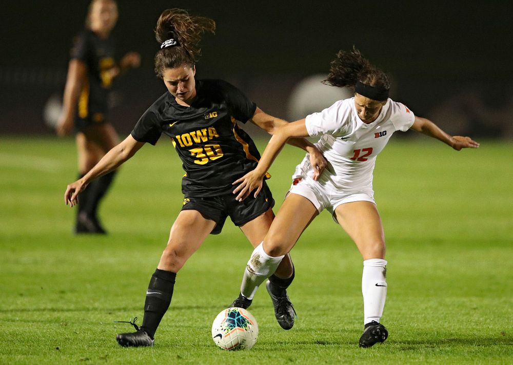 Iowa forward Devin Burns (30) battles for position on the ball during the second half of their match against Illinois at the Iowa Soccer Complex in Iowa City on Thursday, Sep 26, 2019. (Stephen Mally/hawkeyesports.com)