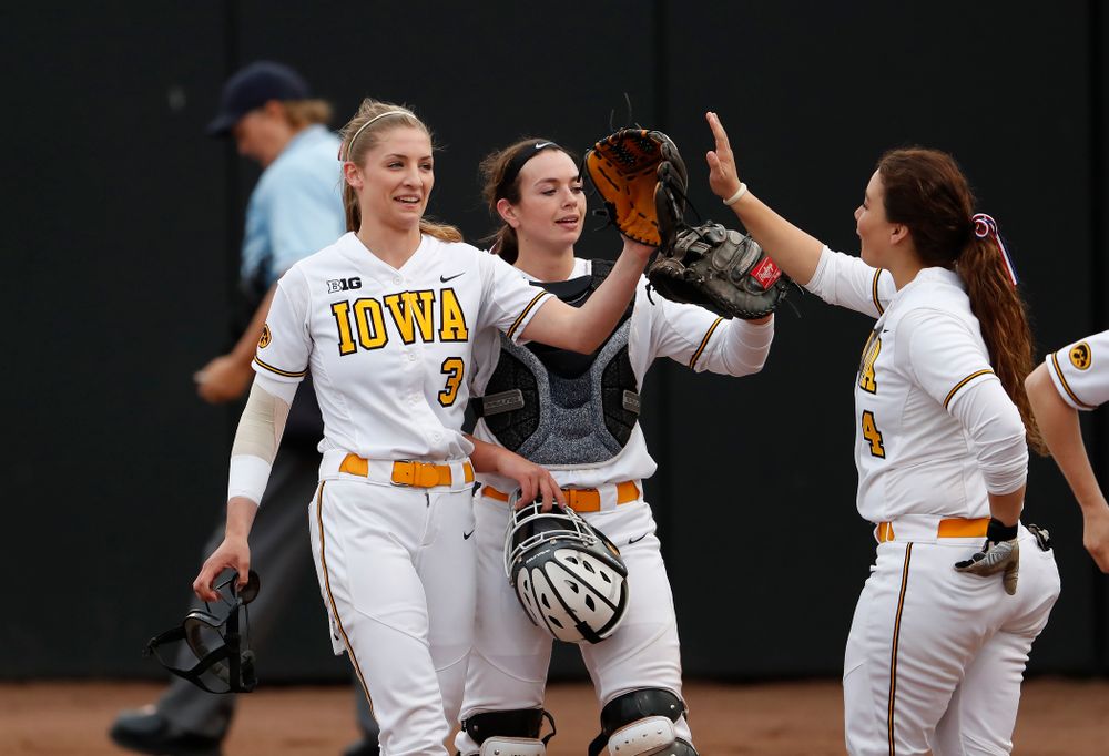 Iowa Hawkeyes starting pitcher/relief pitcher Allison Doocy (3) and infielder Taylor Libby (4) against the Minnesota Golden Gophers  Thursday, April 12, 2018 at Bob Pearl Field. (Brian Ray/hawkeyesports.com)