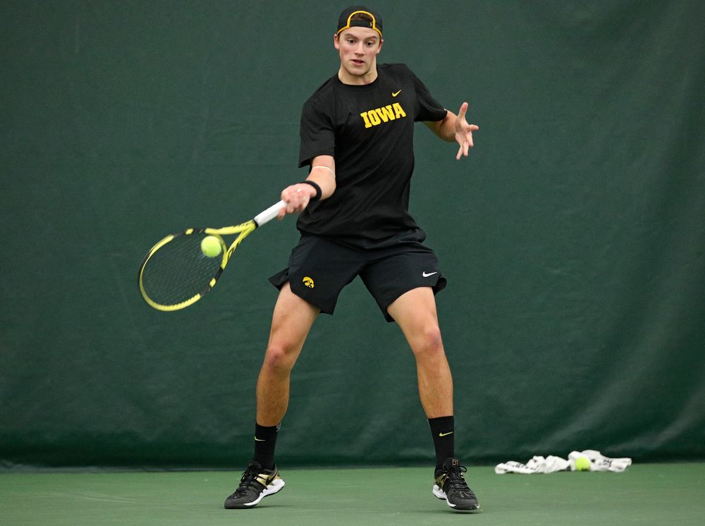 Iowa’s Joe Tyler hits a shot during his match against Marquette at the Hawkeye Tennis and Recreation Complex in Iowa City on Saturday, January 25, 2020. (Stephen Mally/hawkeyesports.com)