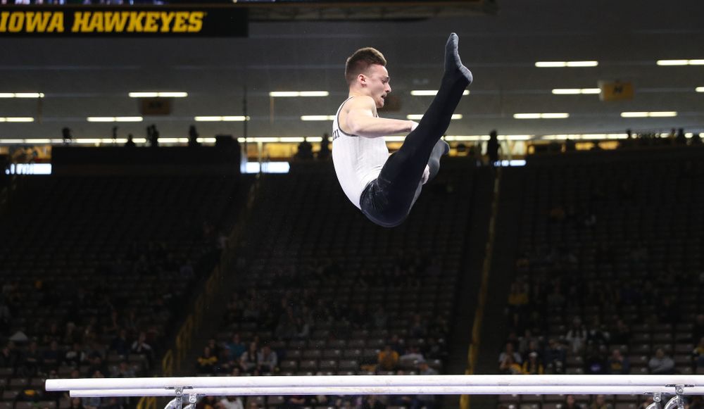 Iowa's Mitch Mandozzi competes on the parallel bars against UIC and Minnesota Saturday, February 2, 2019 at Carver-Hawkeye Arena. (Brian Ray/hawkeyesports.com)
