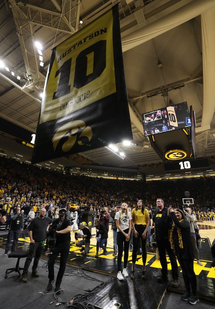 Megan Gustafson stands with her family as her number is raised into the rafters during a jersey retirement ceremony Sunday, January 26, 2020 at Carver-Hawkeye Arena. (Brian Ray/hawkeyesports.com)