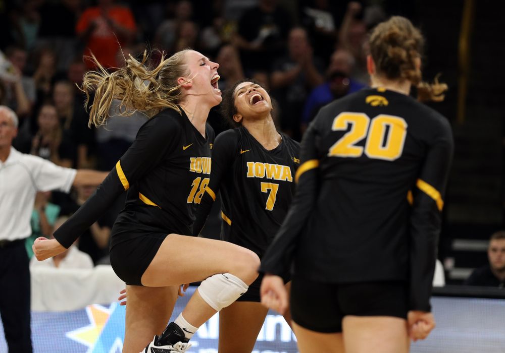 Iowa Hawkeyes middle blocker Hannah Clayton (18) and setter Brie Orr (7) celebrate a point against the Iowa State Cyclones Saturday, September 21, 2019 during the Iowa Corn Cy-Hawk Series Tournament at Carver-Hawkeye Arena. (Brian Ray/hawkeyesports.com)