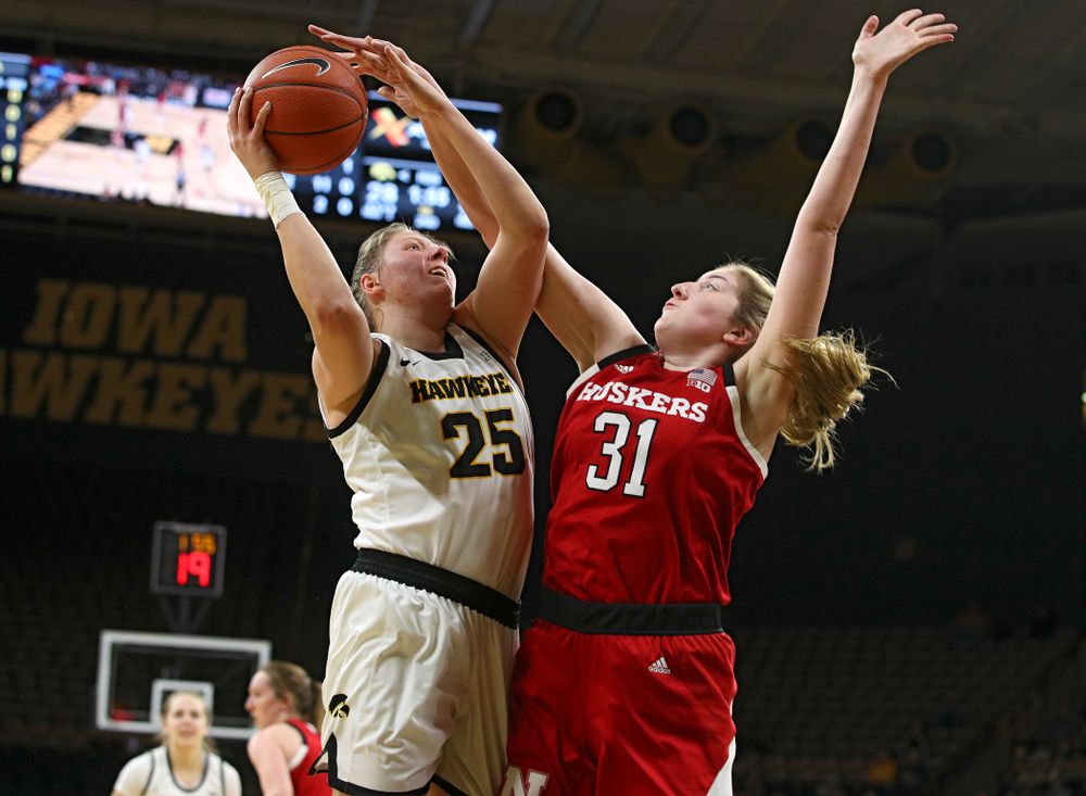 Iowa Hawkeyes forward Monika Czinano (25) makes a basket while being fouled during the second quarter of the game at Carver-Hawkeye Arena in Iowa City on Thursday, February 6, 2020. (Stephen Mally/hawkeyesports.com)