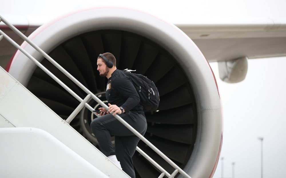 Iowa Hawkeyes offensive lineman Ross Reynolds (59) boards the team plane Wednesday, December 26, 2018 as they travel to Tampa, Florida for the Outback Bowl. (Brian Ray/hawkeyesports.com)