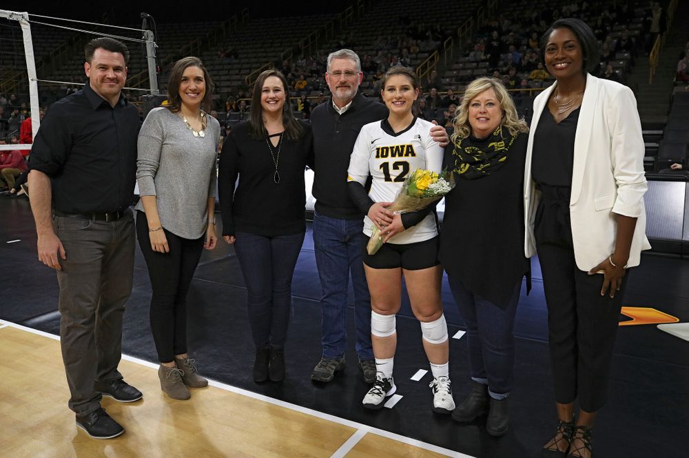 Iowa’s Emily Bushman (12) is honored with her family and the coaching staff on Senior Day before their match at Carver-Hawkeye Arena in Iowa City on Saturday, Nov 30, 2019. (Stephen Mally/hawkeyesports.com)