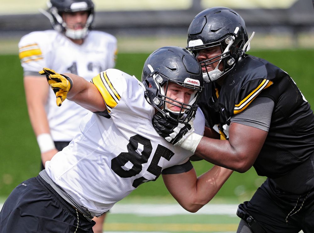 Iowa Hawkeyes defensive end Logan Lee (85) tries to get around offensive lineman Justin Britt (63) during Fall Camp Practice No. 15 at the Hansen Football Performance Center in Iowa City on Monday, Aug 19, 2019. (Stephen Mally/hawkeyesports.com)